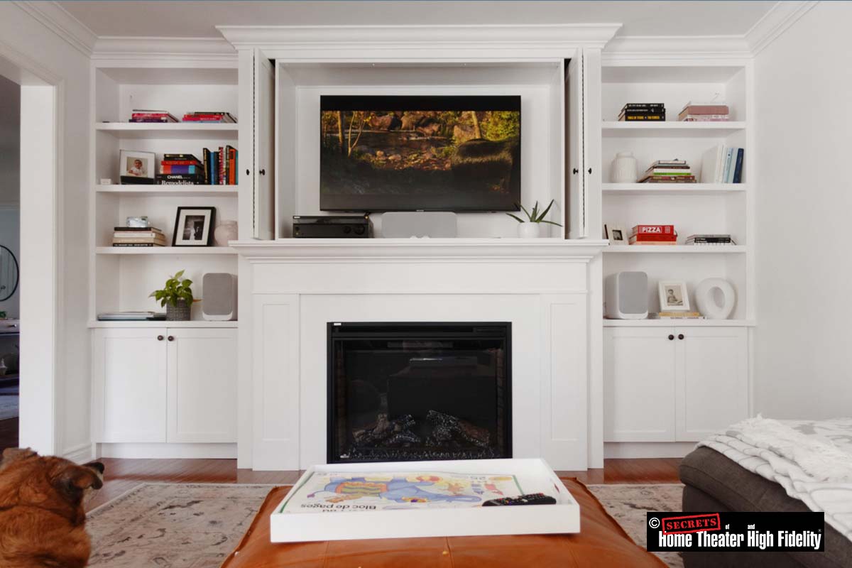 Built in shelves with tv and fireplace