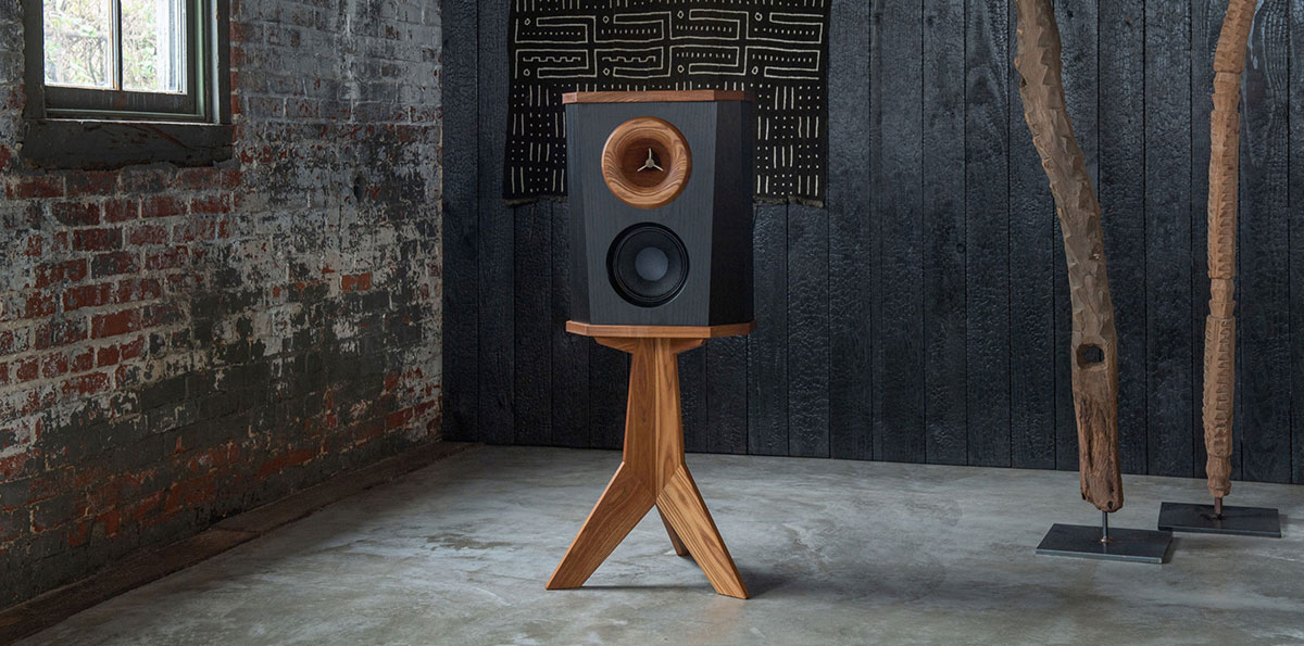 Speaker on wooden stand in rustic building